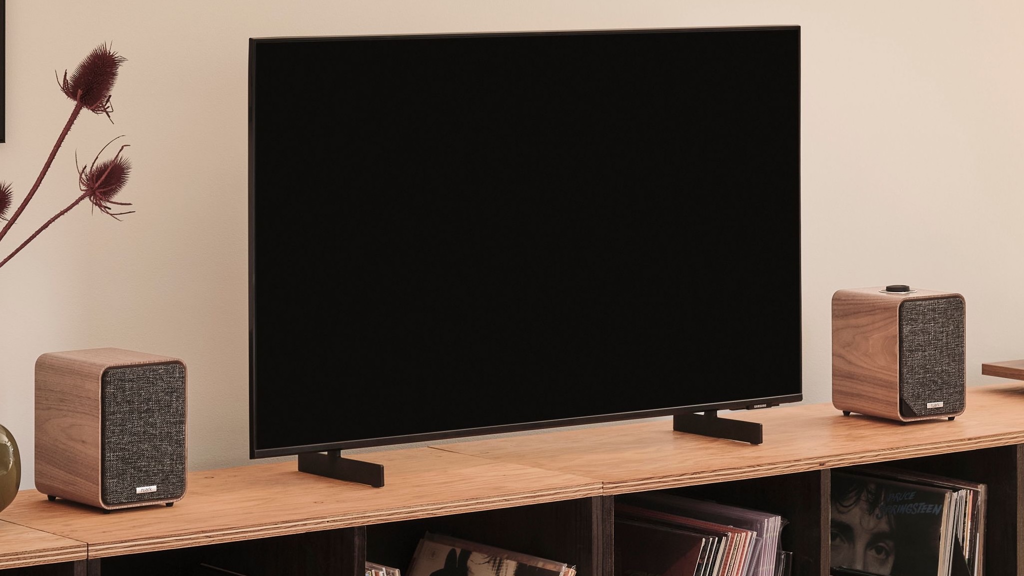 Ruark MR1 Mk3 bluetooth speakers on either side of a TV