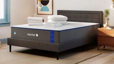 Nectar mattress sale bedding bundle on bed in plain bedroom
