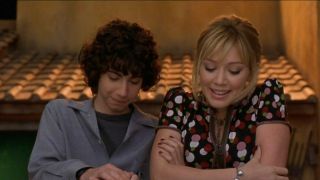 Hilary Duff and Adam Lamberg looking down in The Lizzie McGuire Movie.