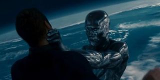 The Silver Surfer choking the life out of Johnny Storm
