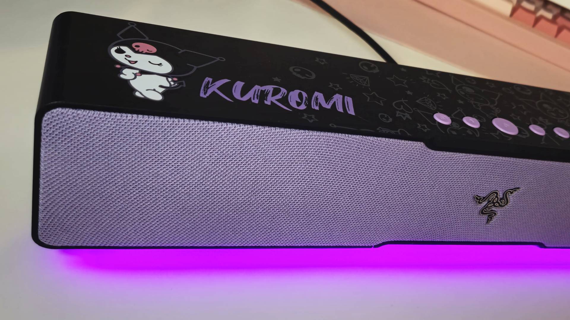 Photo taken by writer Rosalie Newcombe of the Razer Leviathan V2 X Kuromi Edition sound bar., sitting on a white desk.