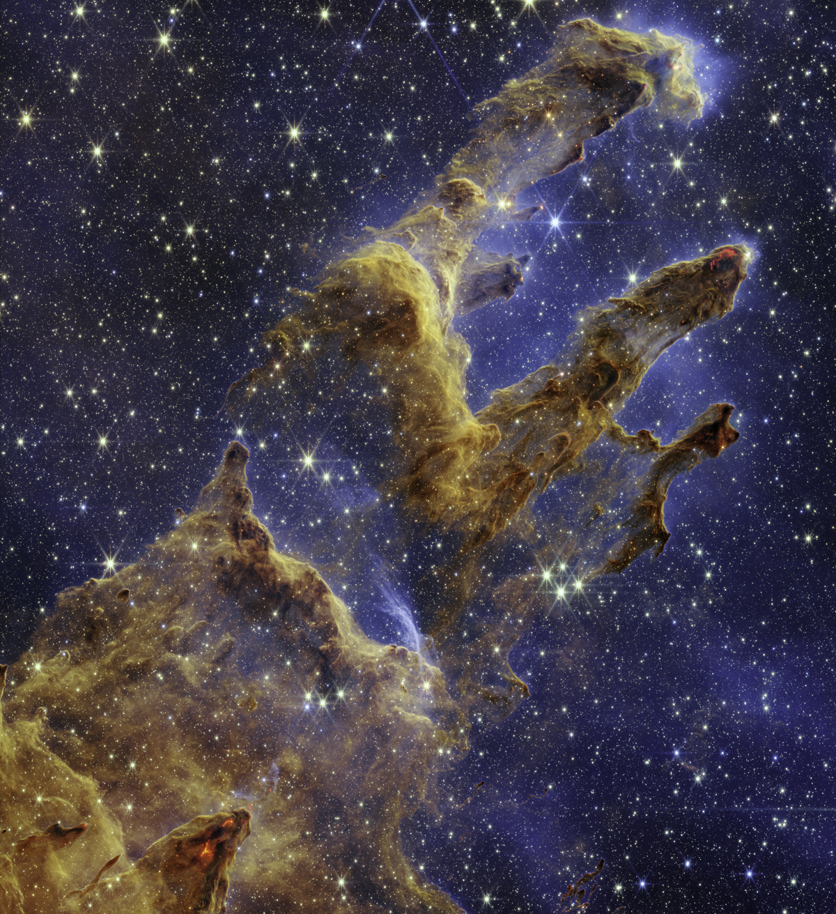 The Pillars of Creation as seen by the James Webb Space Telescope.