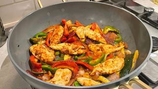 cooked chicken and vegetables in the stanley pan