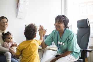 Two young children at the doctors