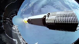 A piece of rocket protecting a set of SpaceX Starlink satellites, known as a fairing, separates from the Falcon 9 rocket during a SpaceX launch.