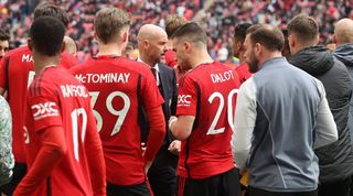 Manchester United manager Erik ten Hag talks to his players ahead of their penalty shootout against Coventry City in the FA Cup semi-finals at Wembley in April 2024.
