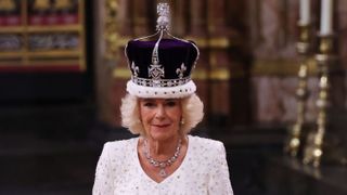 Queen Camilla stands after being crowned by Archbishop of Canterbury Justin Welby during her coronation ceremony in Westminster Abbey