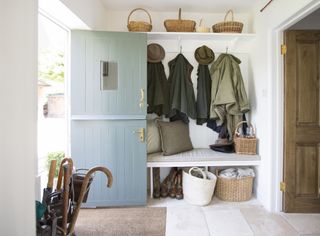 bootroom in hallway with coat hooks, bench abd umbrella stand by wickenden hutley