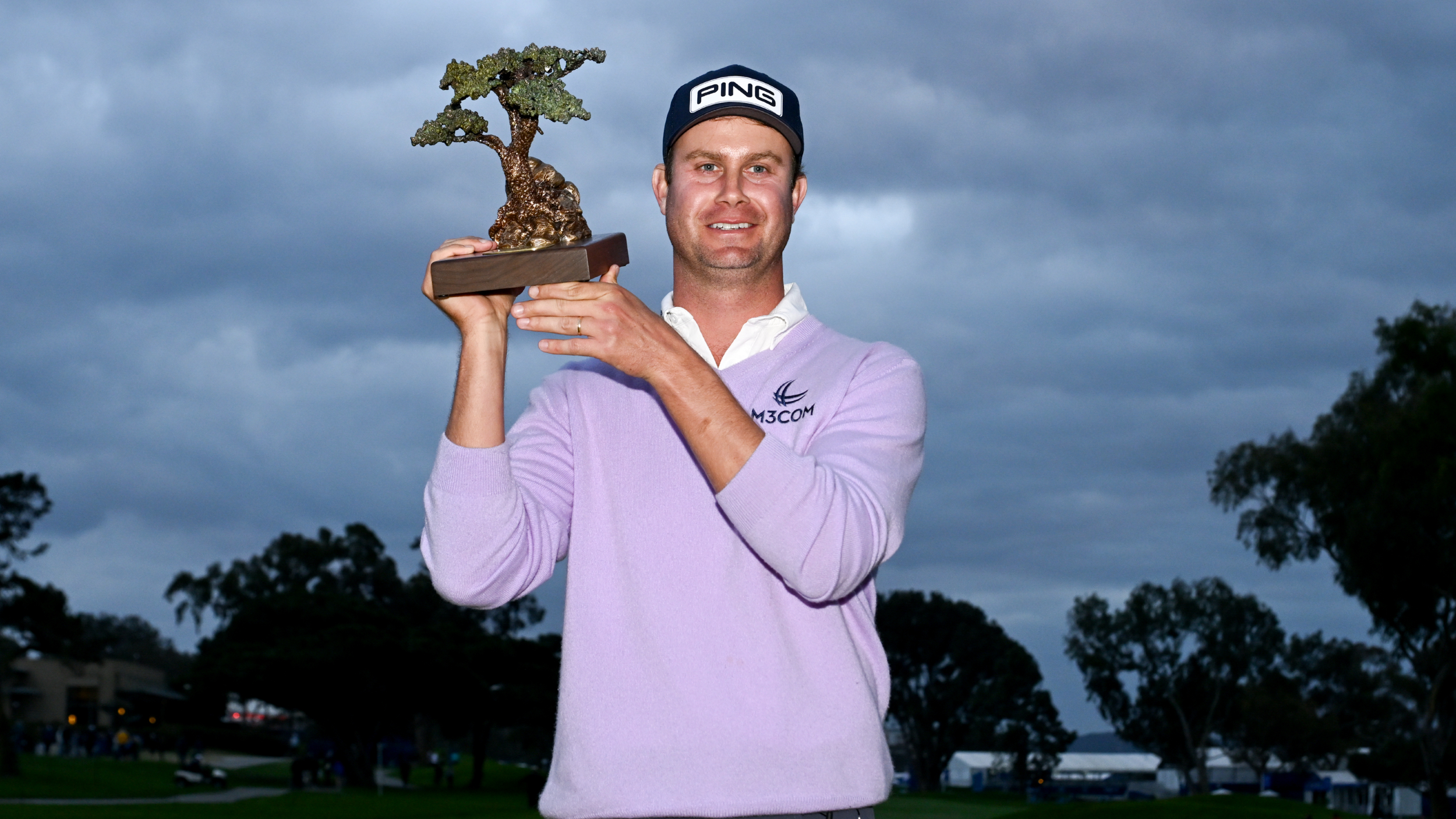 Harris English with the Farmers Insurance Open trophy