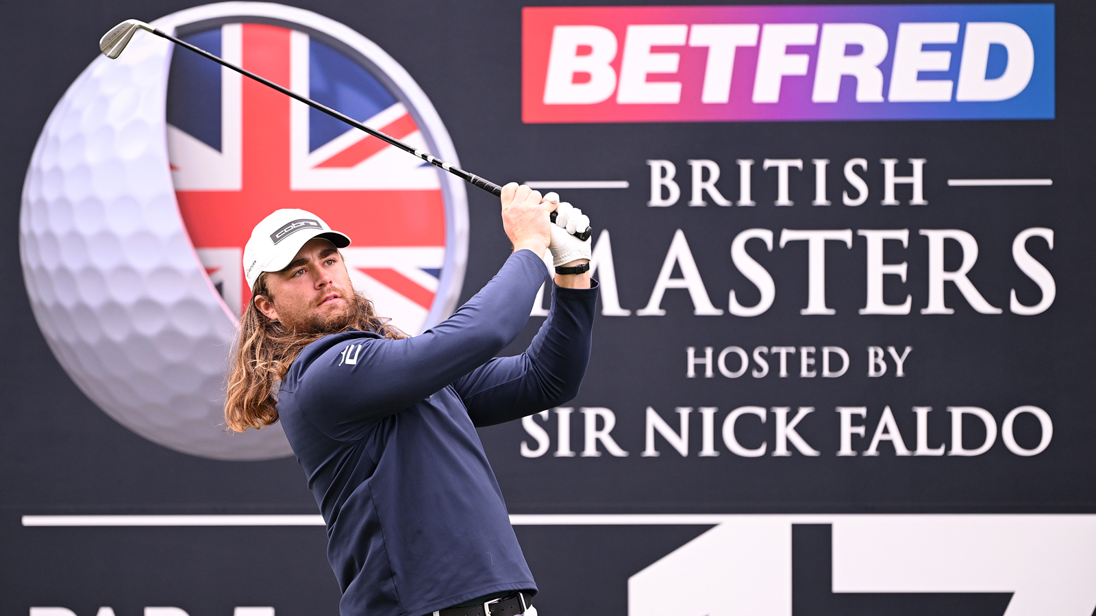 Kyle Berkshire hits an iron off the tee