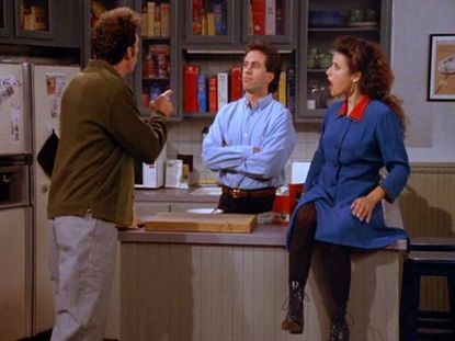 The cast of Seinfeld inside Jerry's apartment.