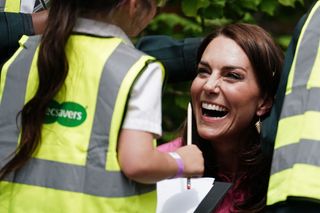 Kate Middleton laughing with children at Chelsea Flower Show