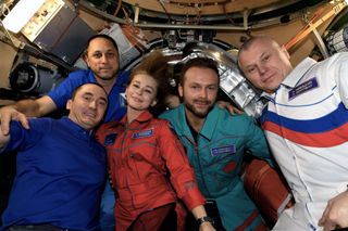 Russian actress Yulia Peresild (center), director Klim Shipenko (second from right) and cosmonaut Oleg Novitskiy (right) bid farewell to their Russian crewmates Anton Shkaplerov (second from left) and Pyotr Dubrov before returning to Earth on Oct. 17, 2021.
