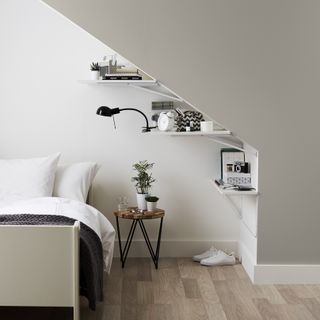 B&Q Goodhome Cleveland in a chic minimal and monochrome bedroom with shelves and a bedside table