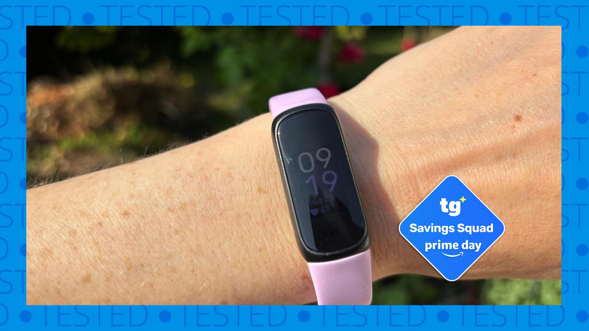The image shows a woman's wrist with a pale pink Fitbit Inspire 3on it. Inset, a Tom's Guide Savings Squad Prime Day deal badge is shown in blue