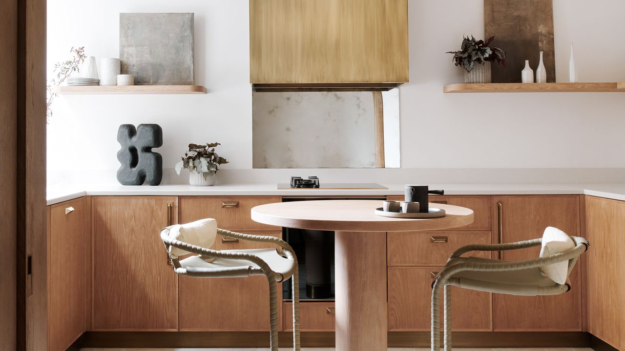 a small kitchen with a small round table