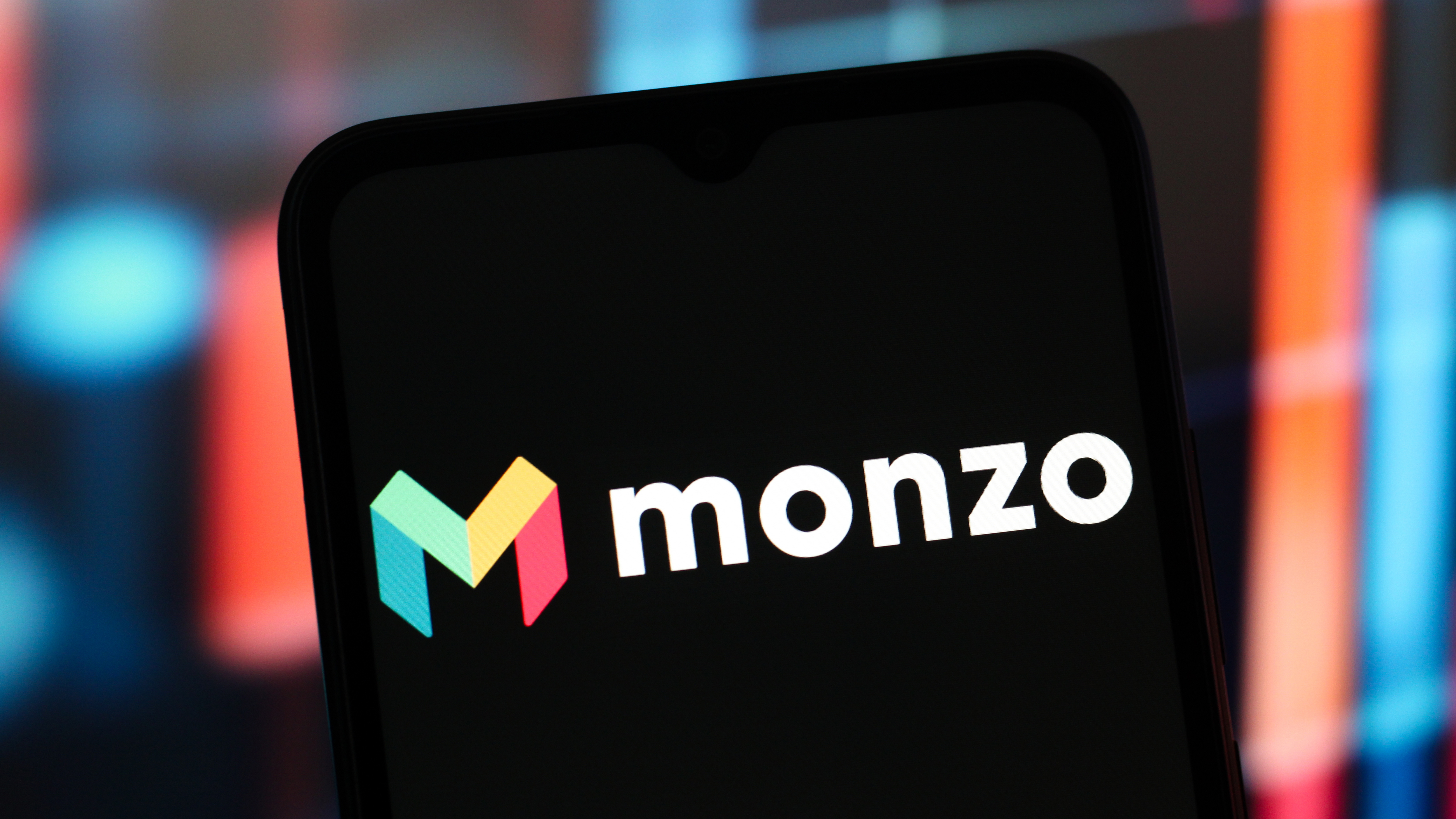 A phone showing the Monzo logo