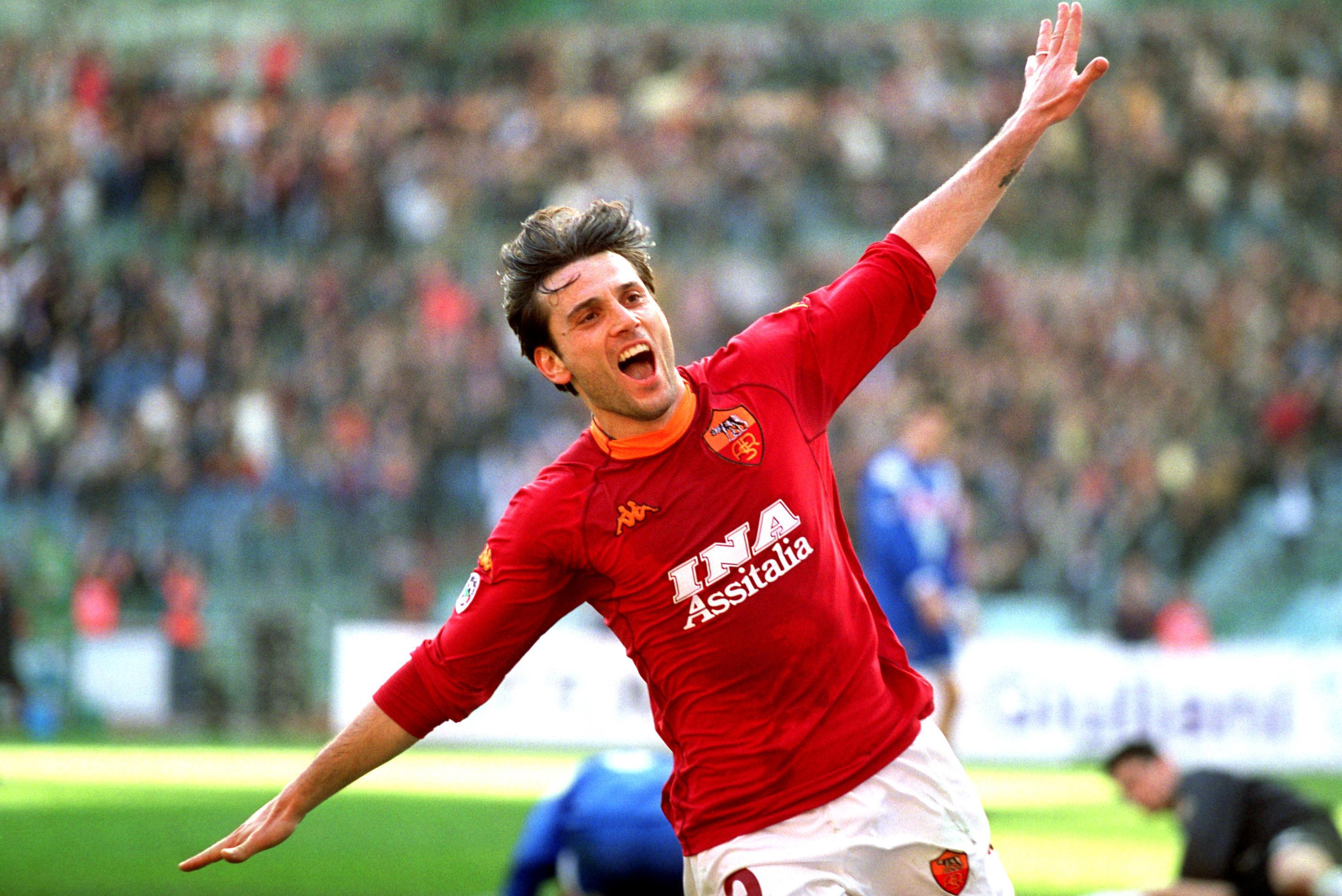 Vincenzo Montella does his trademark aeroplane celebration after scoring for Roma against Brescia, 2001