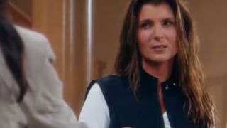 Kimberlin Brown in a dark vest and white shirt looking skeptical in The Bold And The Beautiful