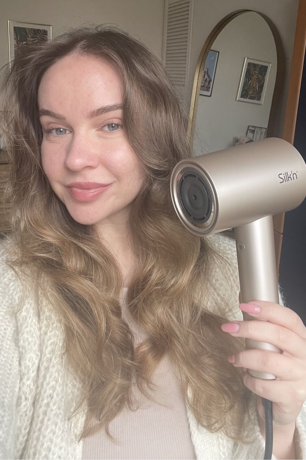 Valeza holding one of the dyson supersonic alternatives