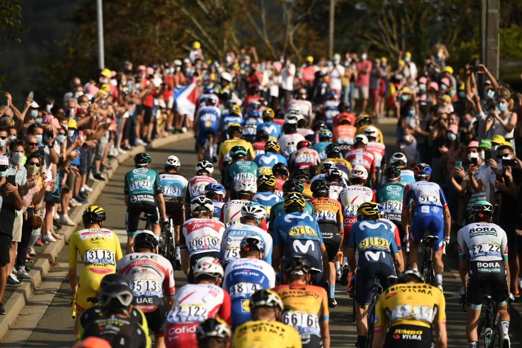 The pack rides during the 21st and last stage of the 107th edition of the Tour de France cycling race 122 km between ManteslaJolie and Champs Elysees Paris on September 20 2020 Photo by Marco Bertorello AFP Photo by MARCO BERTORELLOAFP via Getty Images