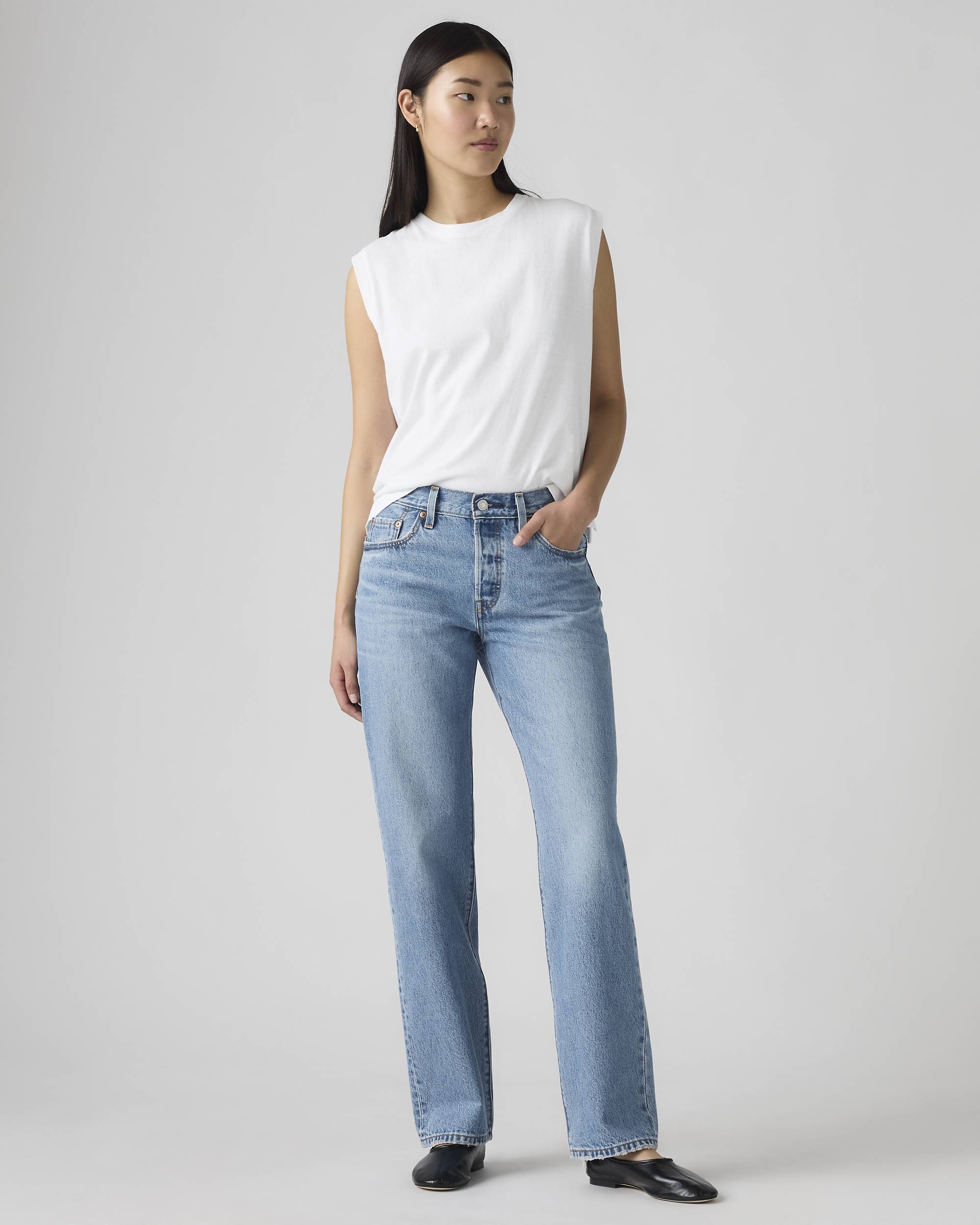 A model wearing Levi's straight-leg jeans.