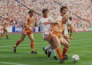 Ronald Koeman shields the ball from two Soviet Union players as brother and Netherlands team-mate Erwin watches on in the Euro 88 final.