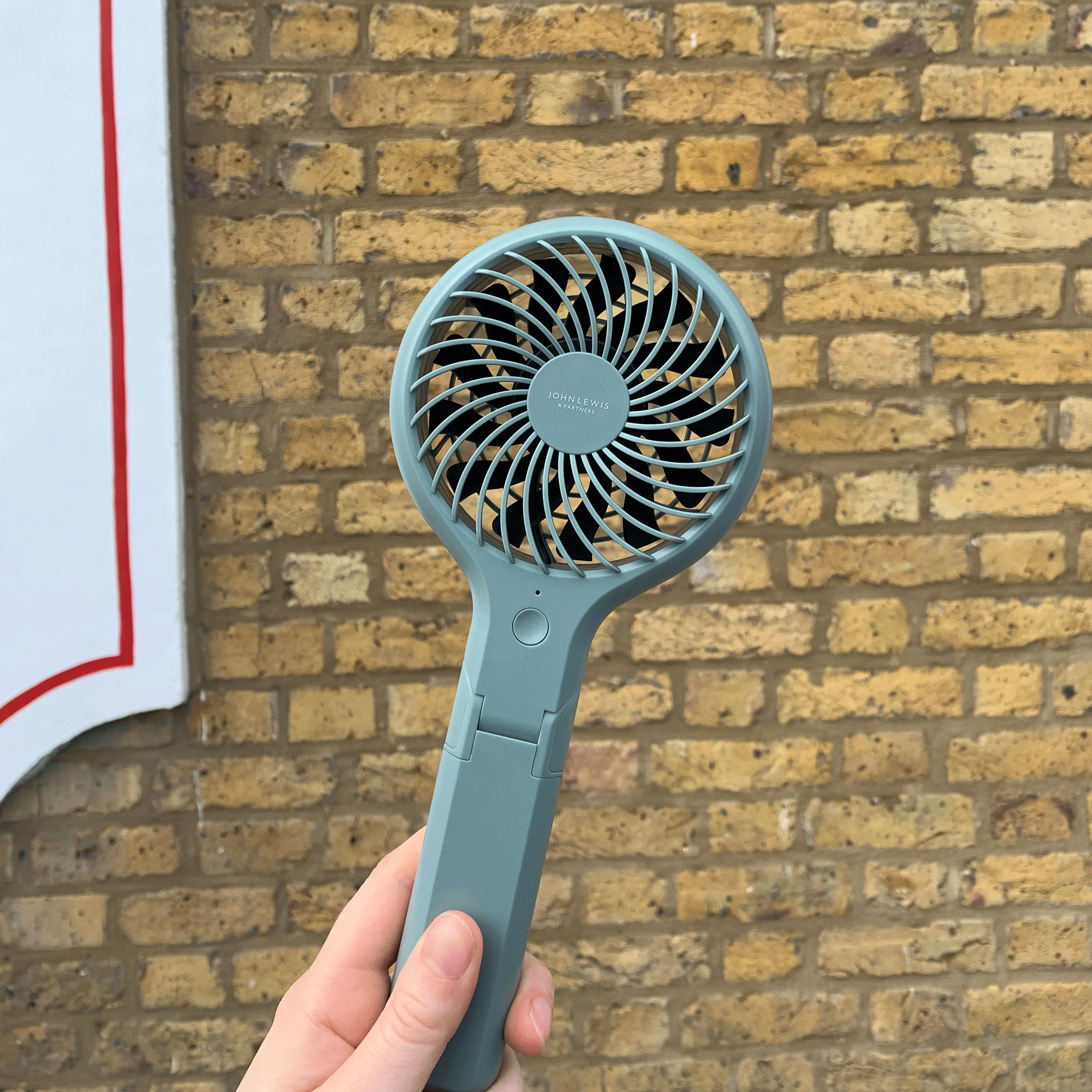 Green handheld fan 