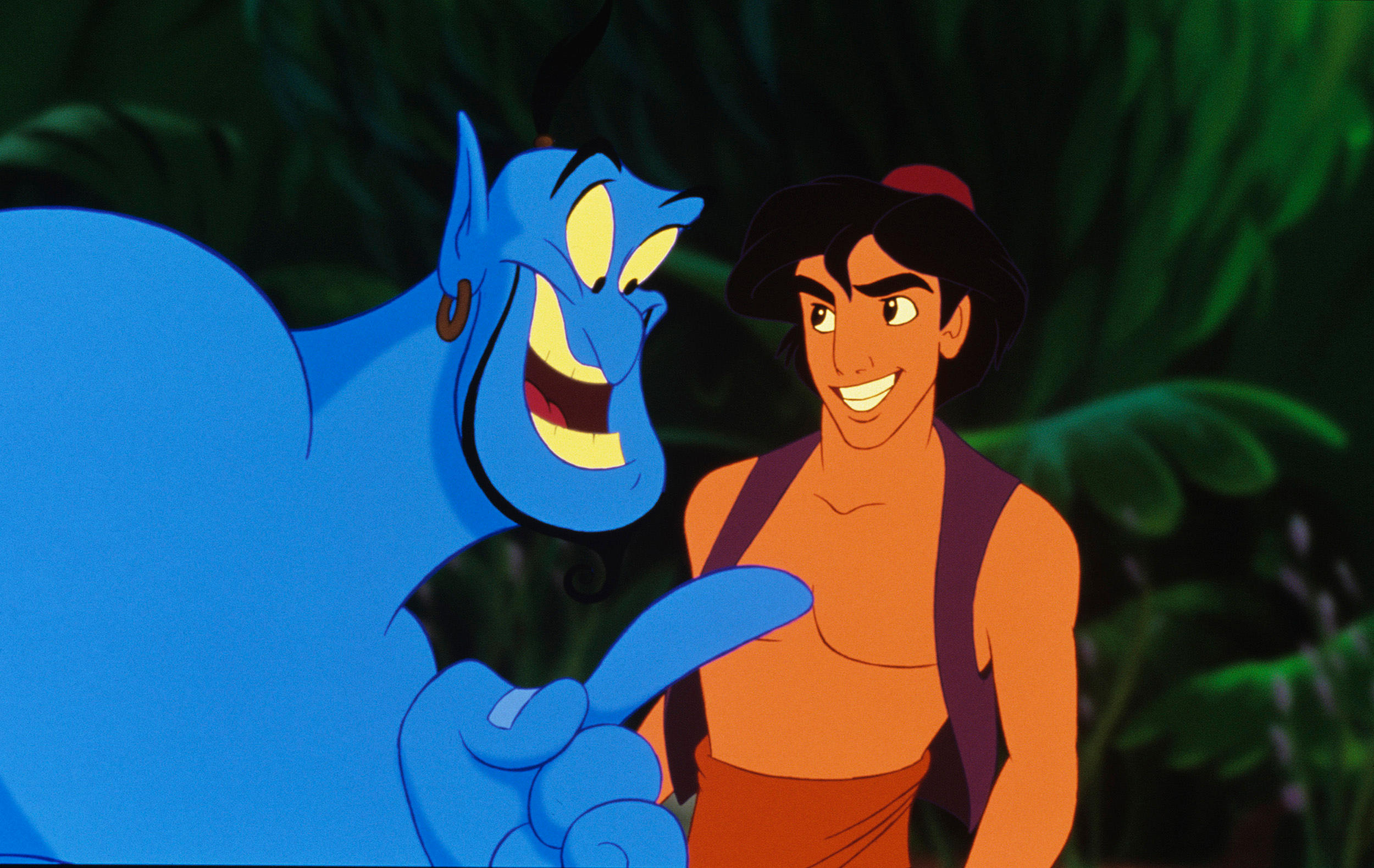 A still from 'Aladdin' of the blue genie talking to aladdin in the jungle