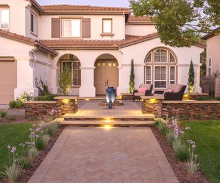 front yard design with paving and deck area
