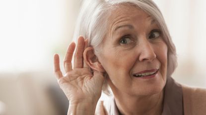 Woman struggling with hearing loss