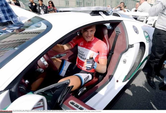 Marcel Kittel checks out one of the local police cars