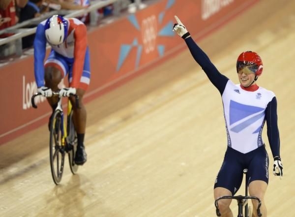 Britain's Jason Kenny (R) celebrates after crossing the finish line ahead of France's Gregory Bauge to win the gold medal in the London 2012 Olympic Games men's sprint final