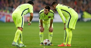 Luis Suarez, Lionel Messi and Neymar of Barcelona discuss a free kick during the UEFA Champions League Group F match between AFC Ajax and FC Barcelona at The Amsterdam Arena on November 5, 2014 in Amsterdam, Netherlands.