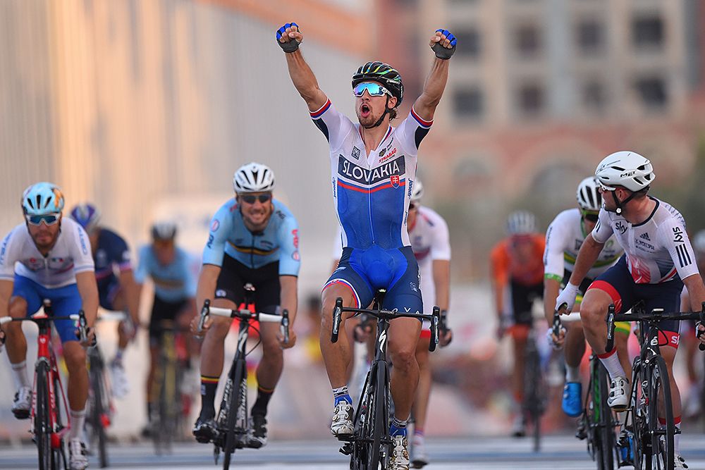 Peter Sagan raises his arms in victory, taking a second world title