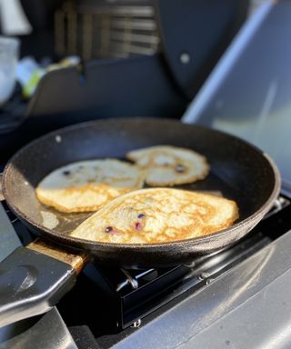cooking pancakes on the side burner of a Weber gas BBQ