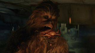 Chewie trying to heat a porg in The Last Jedi