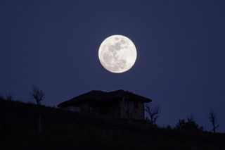 a spooky self build with a full moon