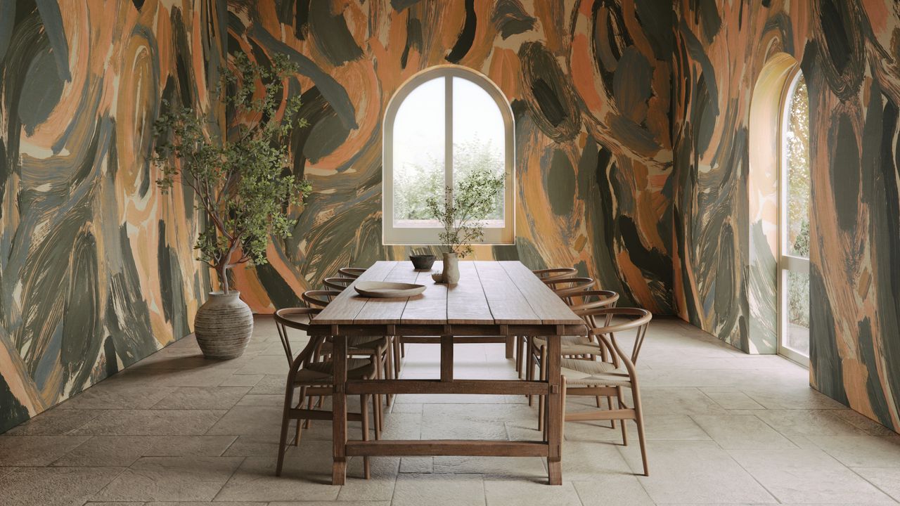 Expressive mural-style wallpaper in a dining room