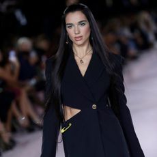 Dua Lipa walks the runway at the Versace fashion show during the Milan Fashion Week - Spring / Summer 2022 on September 24, 2021 in Milan, Italy. (Photo by Vittorio Zunino Celotto/Getty Images)