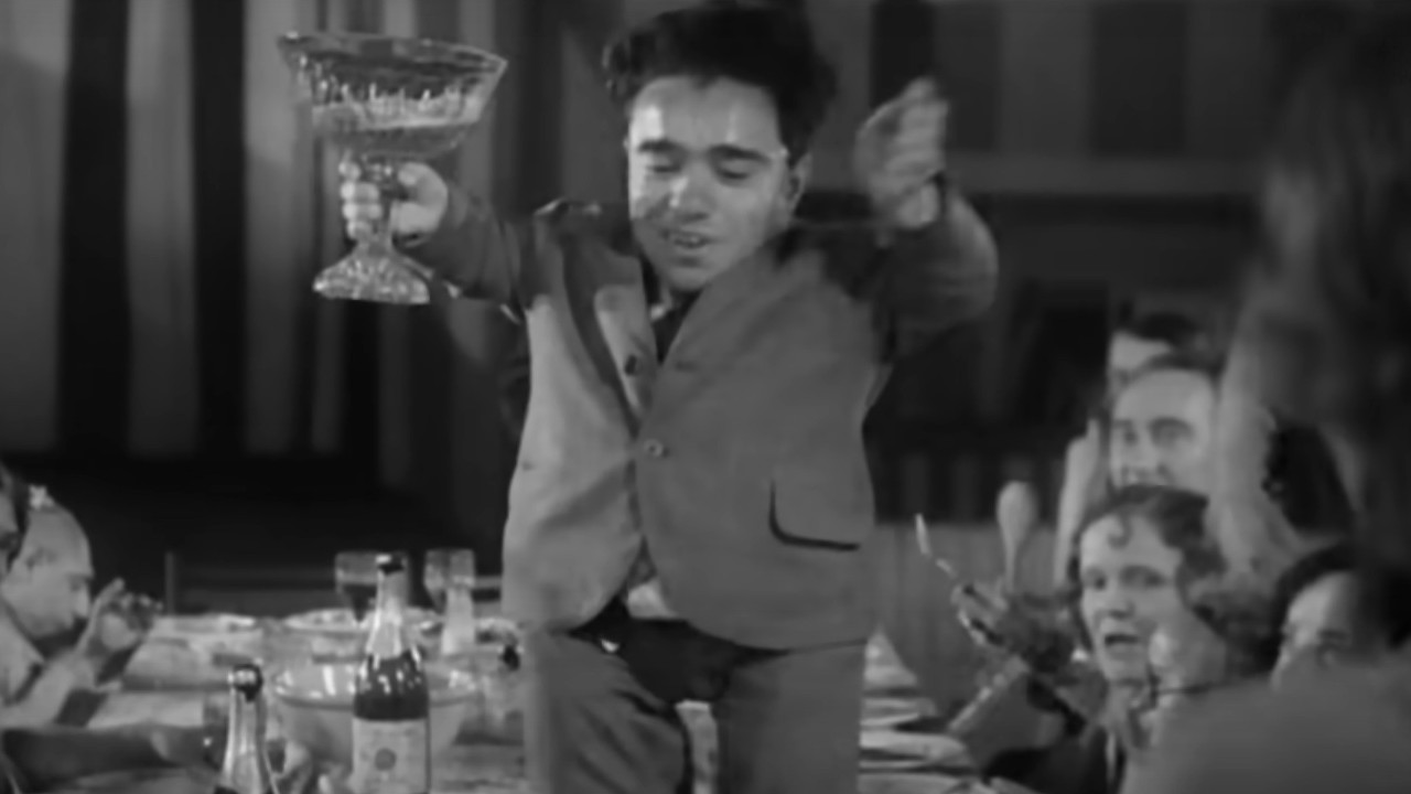 A man dancing on a table in Freaks