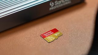 A Sandisk SD card on a surface.