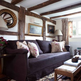 living room with sofa and floral cushions