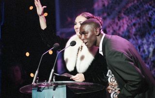 Andy Cole, alongside Martine McCutcheon, presenting an award at the MOBO Awards in London in October 1998.