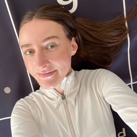 Health writer Katie trying the new Pvolve Longevity Bundle: At home on her Pvolve mat