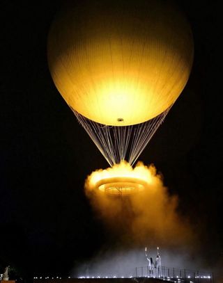 The Olympic cauldron rises to 60-metres in the air from sunset to 2am each night and is visible from much of central Paris