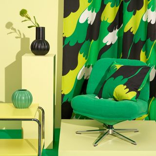 Green IKEA DYVLINGE armchair with graphic cushion in yellow room