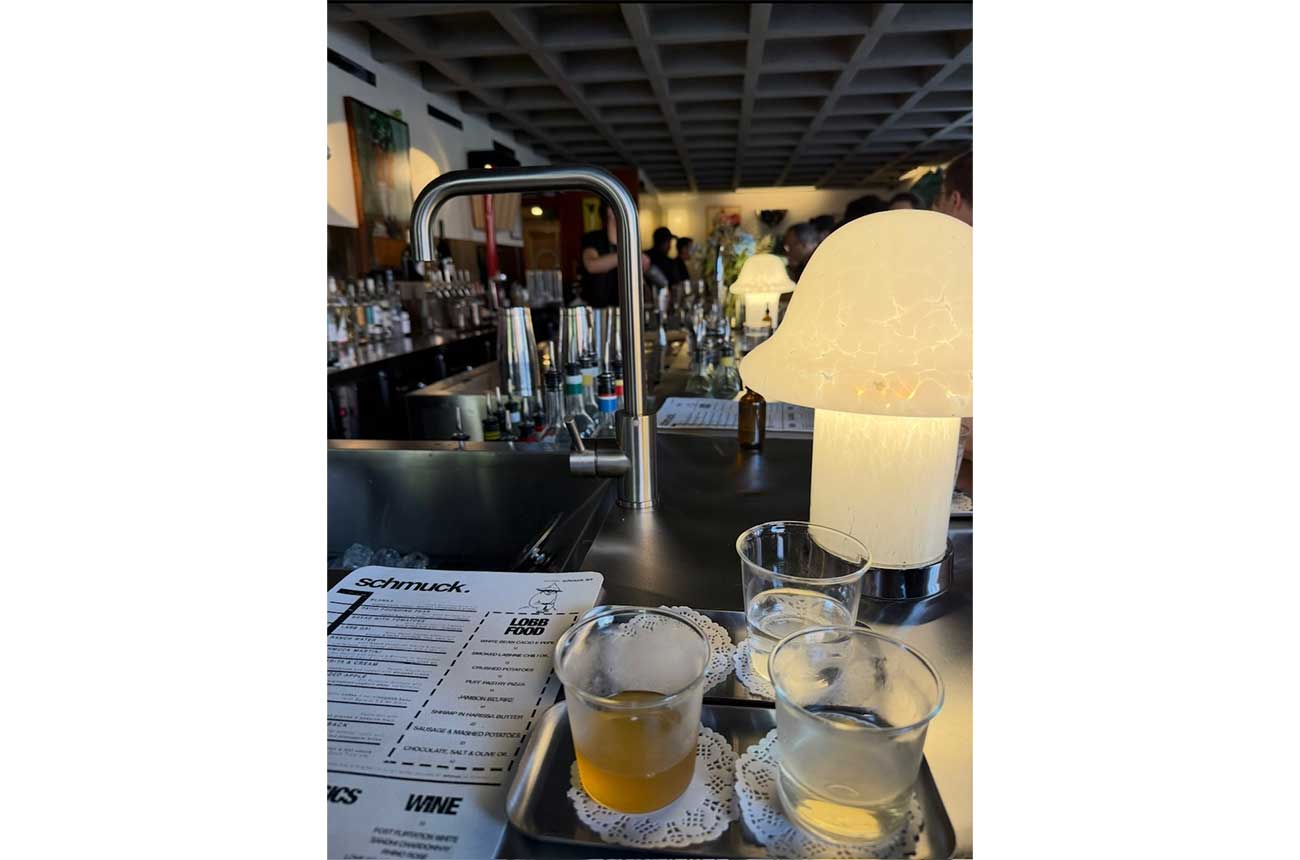 Faucet on bar with drinks and menu