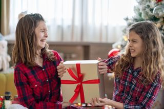 two girls arguing over a Christmas present
