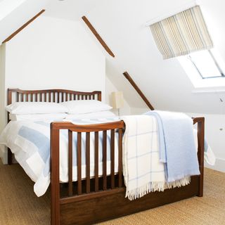 attic white bedroom with bed and carpet floor